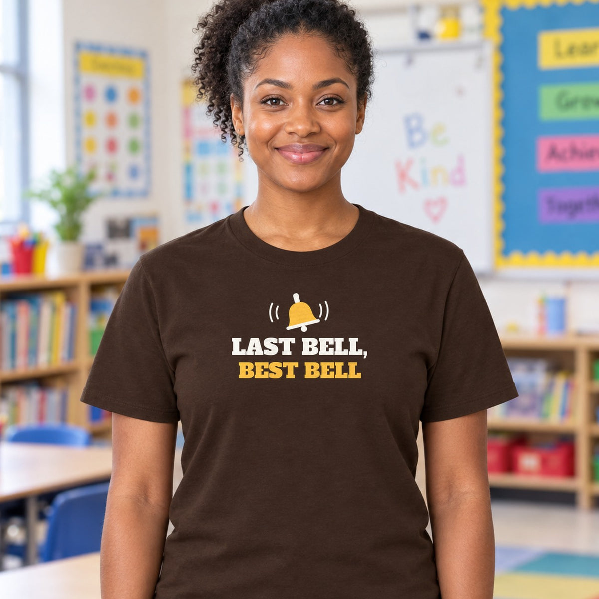 Woman wearing the dark chocolate Last Bell, Best Bell graphic tee