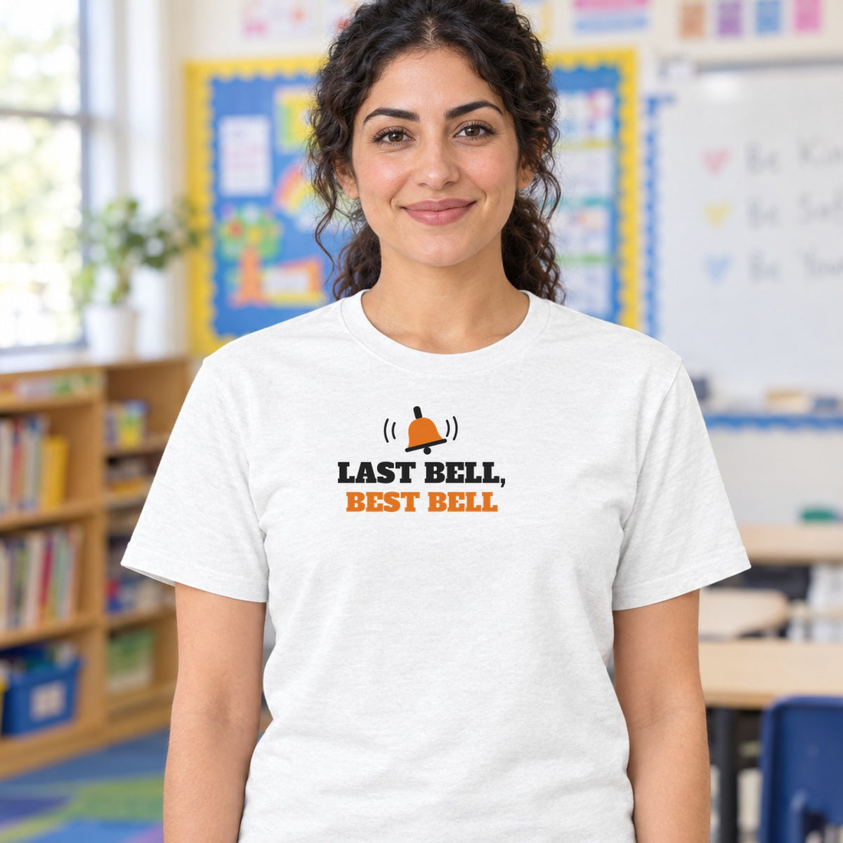 Woman wearing the white Last Bell, Best Bell graphic tee