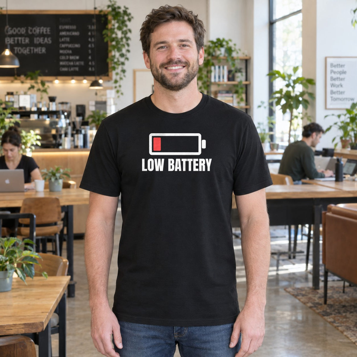 Man wearing the black Low Battery graphic tee