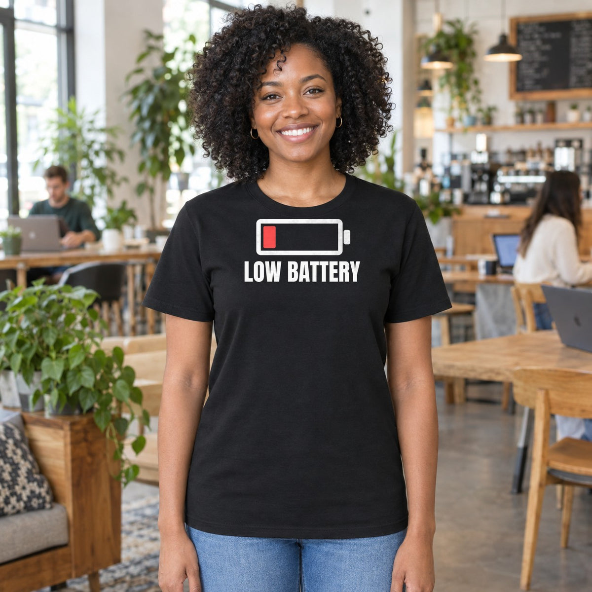 Woman wearing the black Low Battery graphic tee