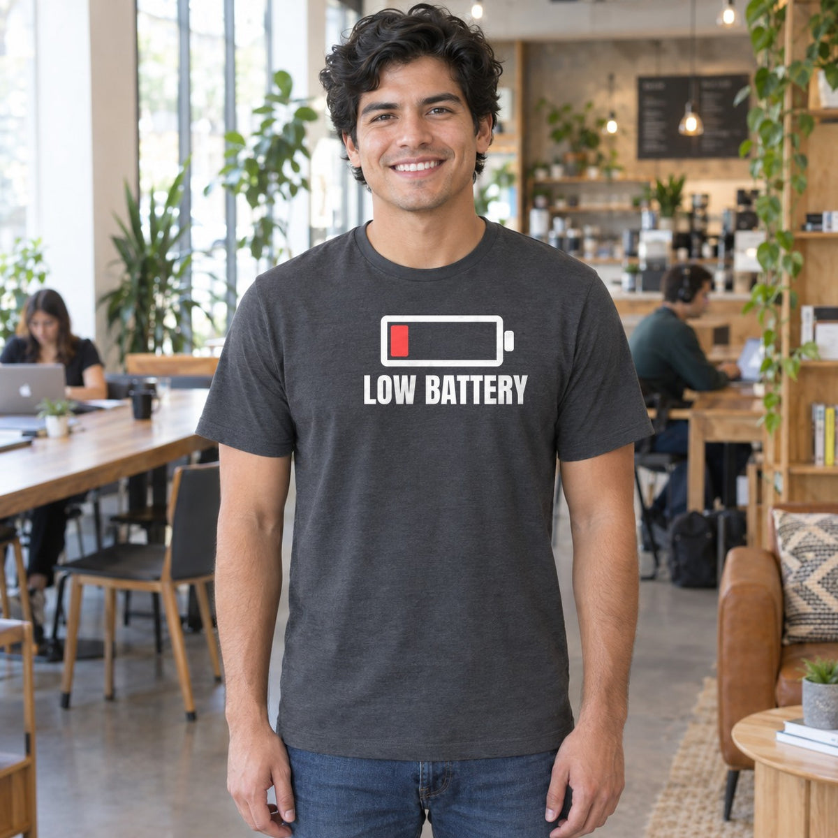 Man wearing the charcoal Low Battery graphic tee