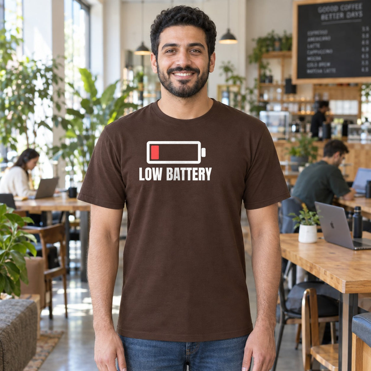 Man wearing the dark chocolate Low Battery graphic tee
