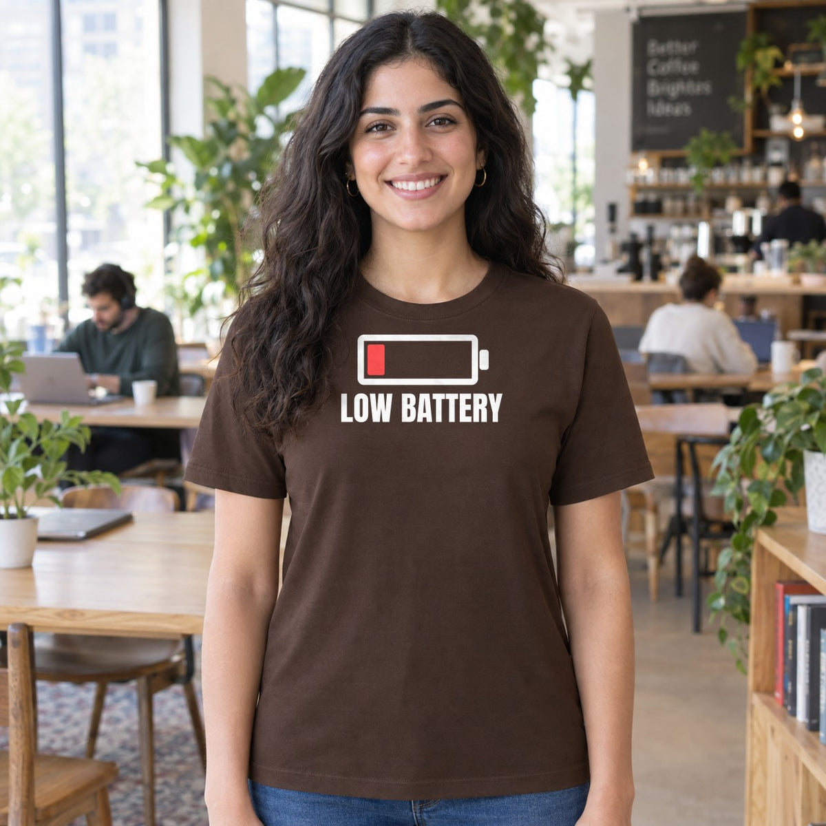 Woman wearing the dark chocolate Low Battery graphic tee