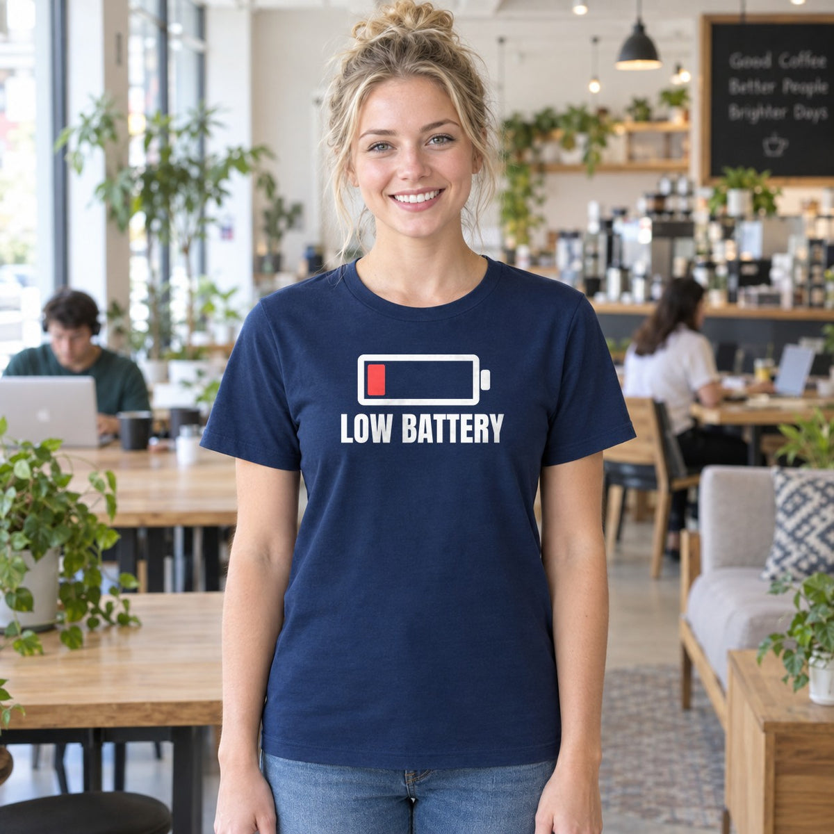 Woman wearing the navy Low Battery graphic tee