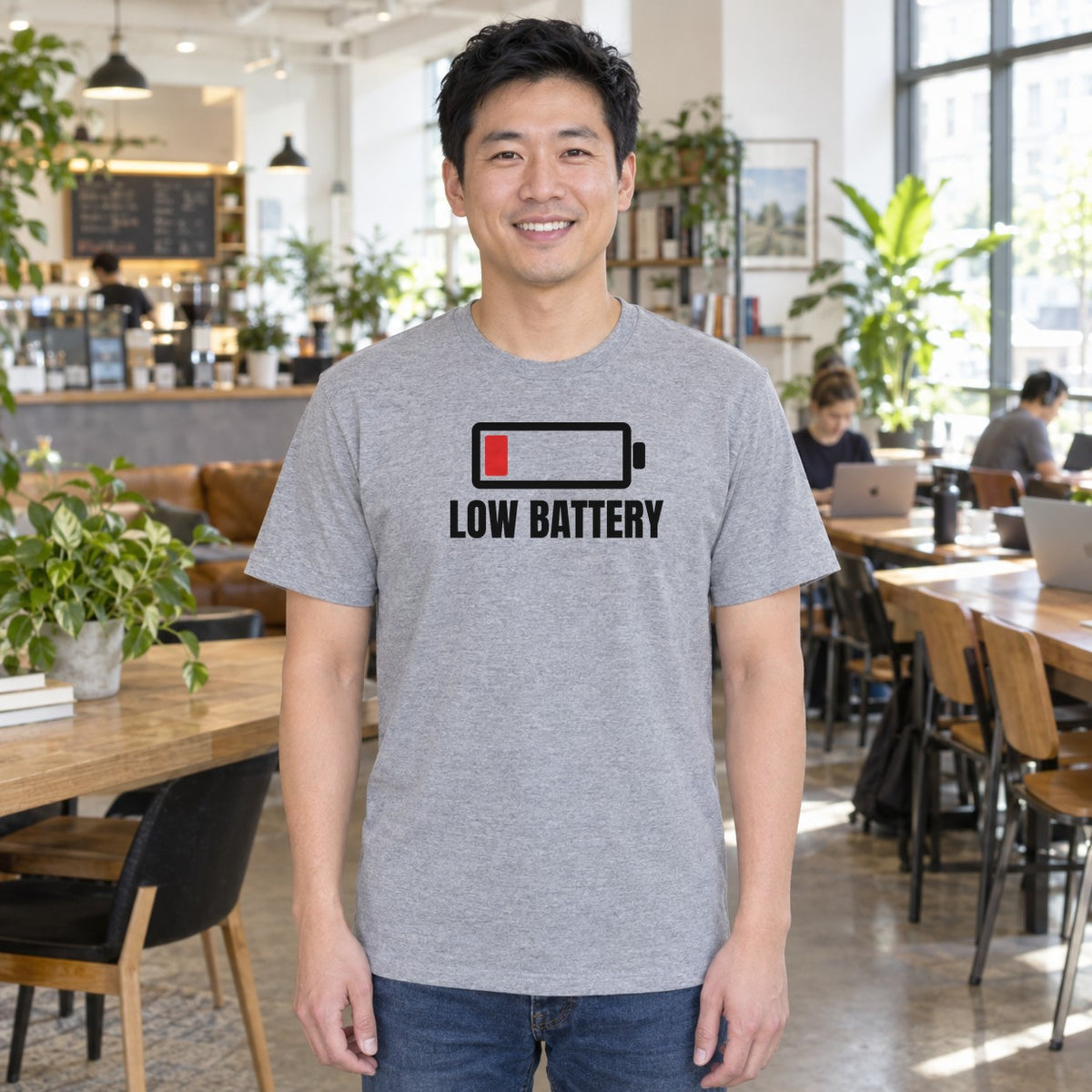 Man wearing the sport grey Low Battery graphic tee