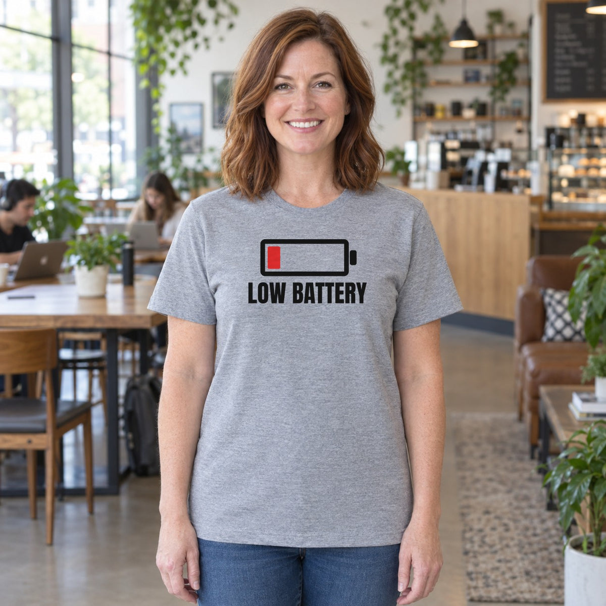 Woman wearing the sport grey Low Battery graphic tee