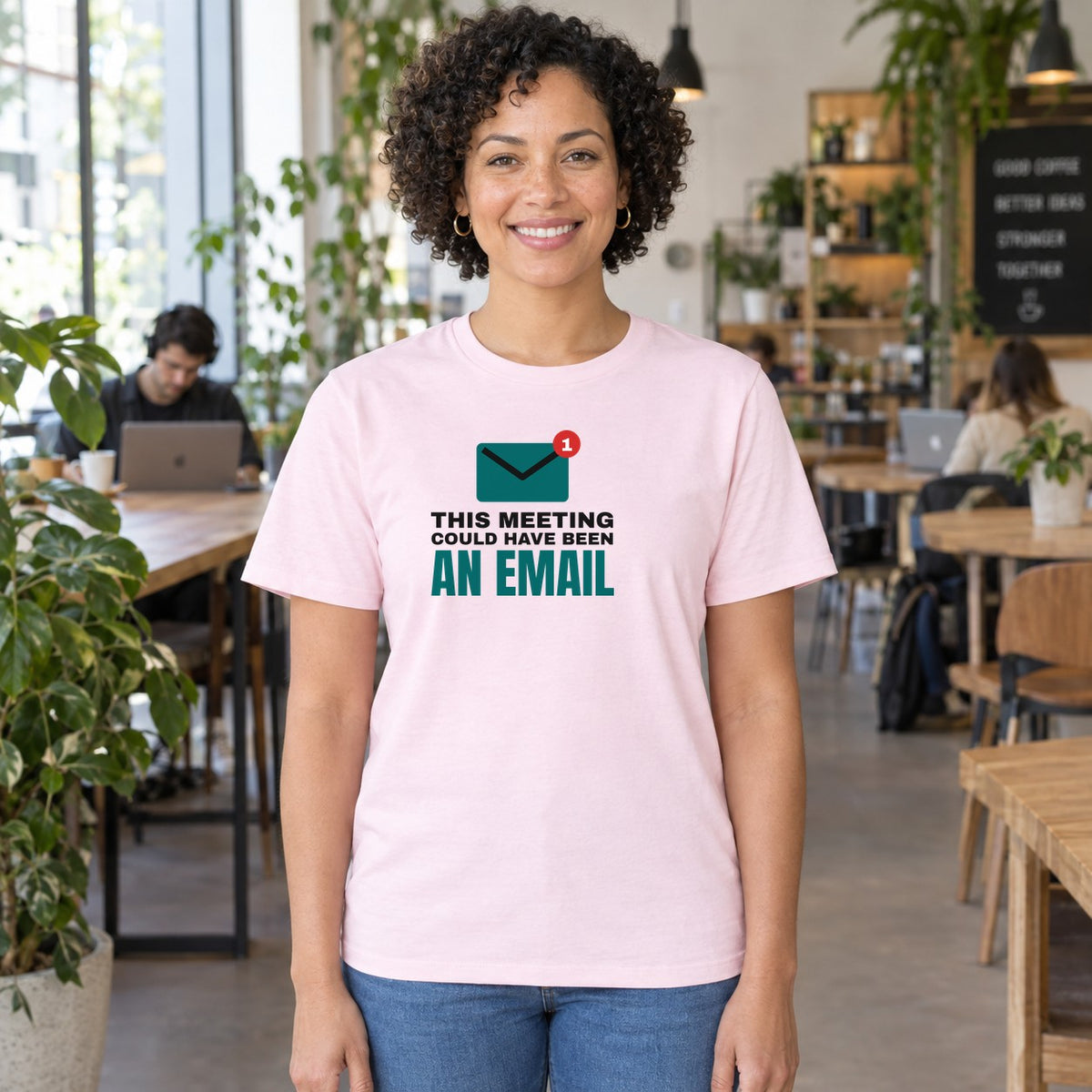 Woman wearing the light pink Could Have Been an Email graphic tee