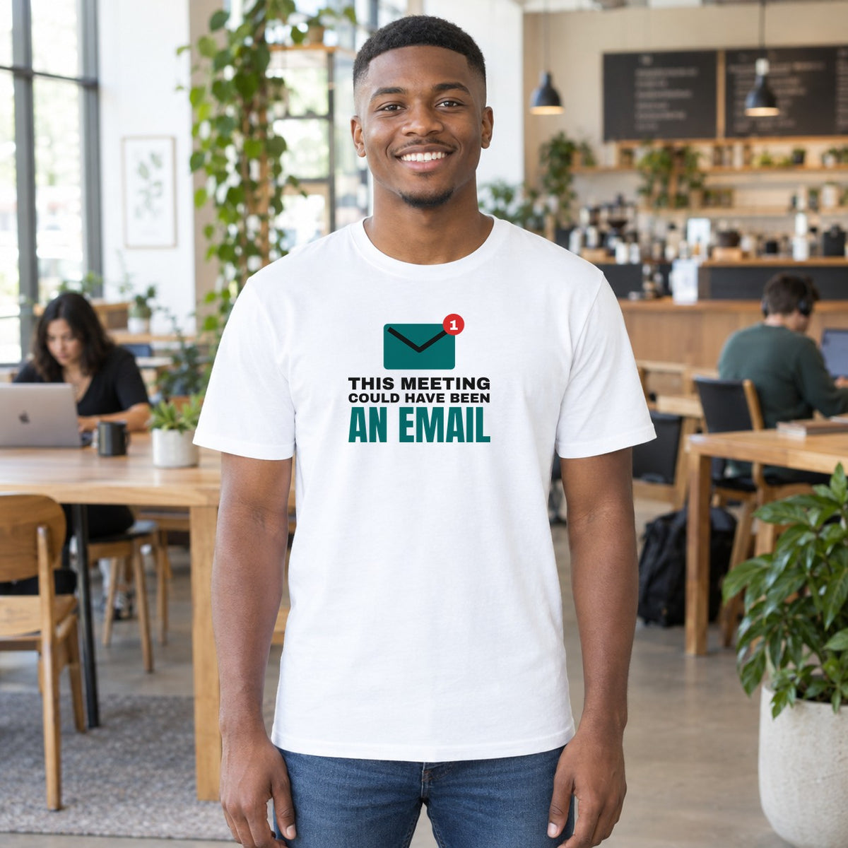 Man wearing the white Could Have Been an Email graphic tee