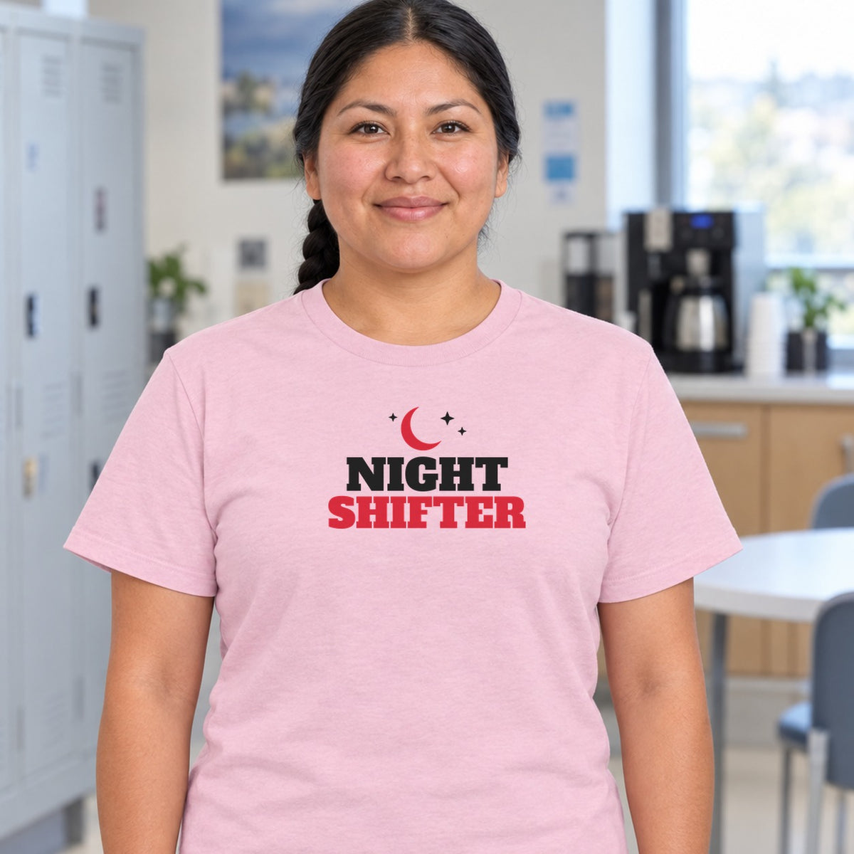 Woman wearing the light pink Night Shifter graphic tee