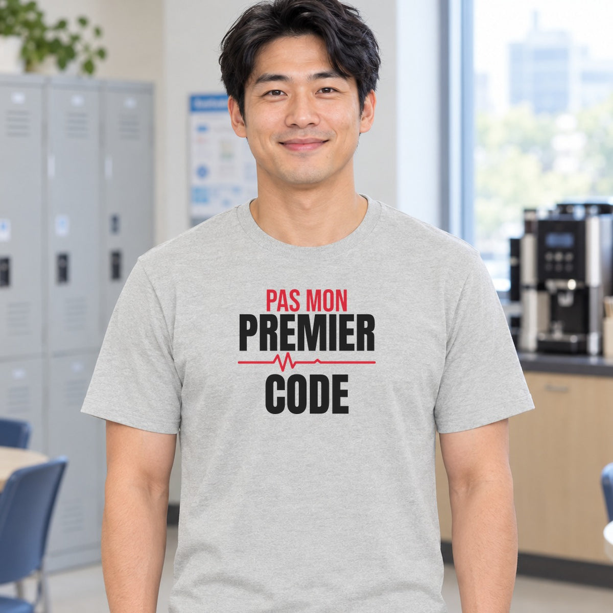 Man wearing the ash Pas mon premier code graphic tee