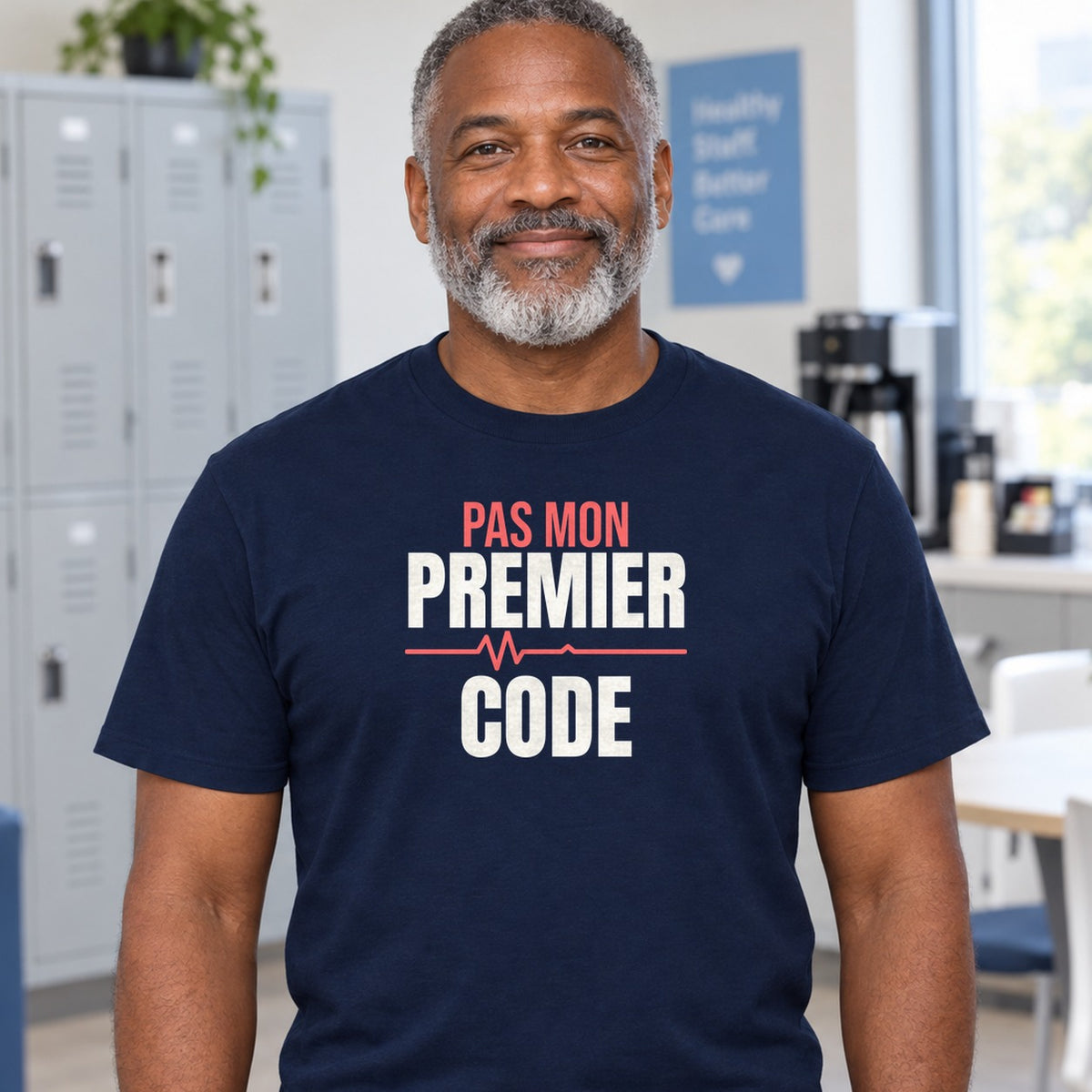 Man wearing the navy Pas mon premier code graphic tee