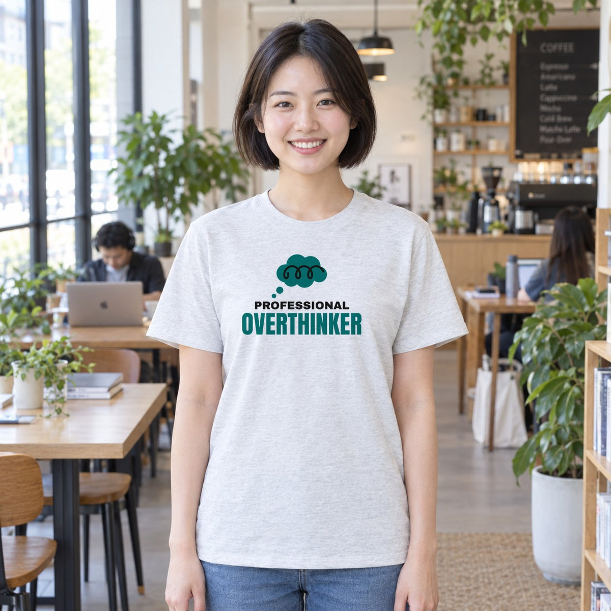 Woman wearing the ash Professional Overthinker graphic tee