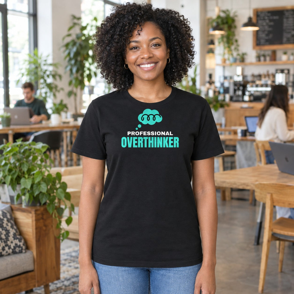 Woman wearing the black Professional Overthinker graphic tee