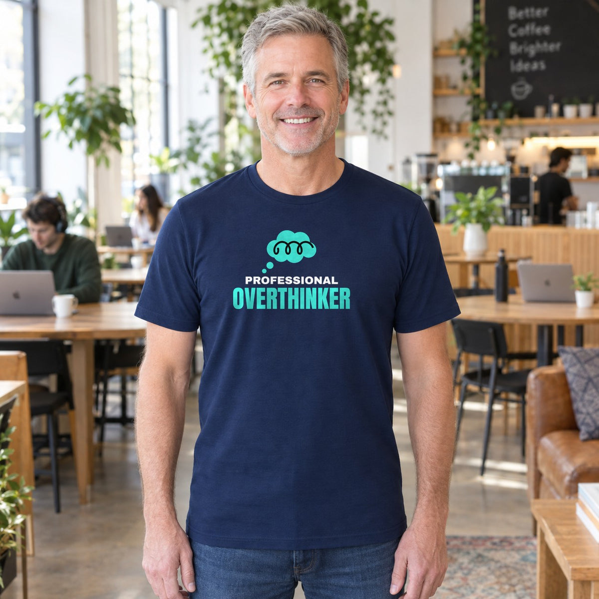 Man wearing the navy Professional Overthinker graphic tee