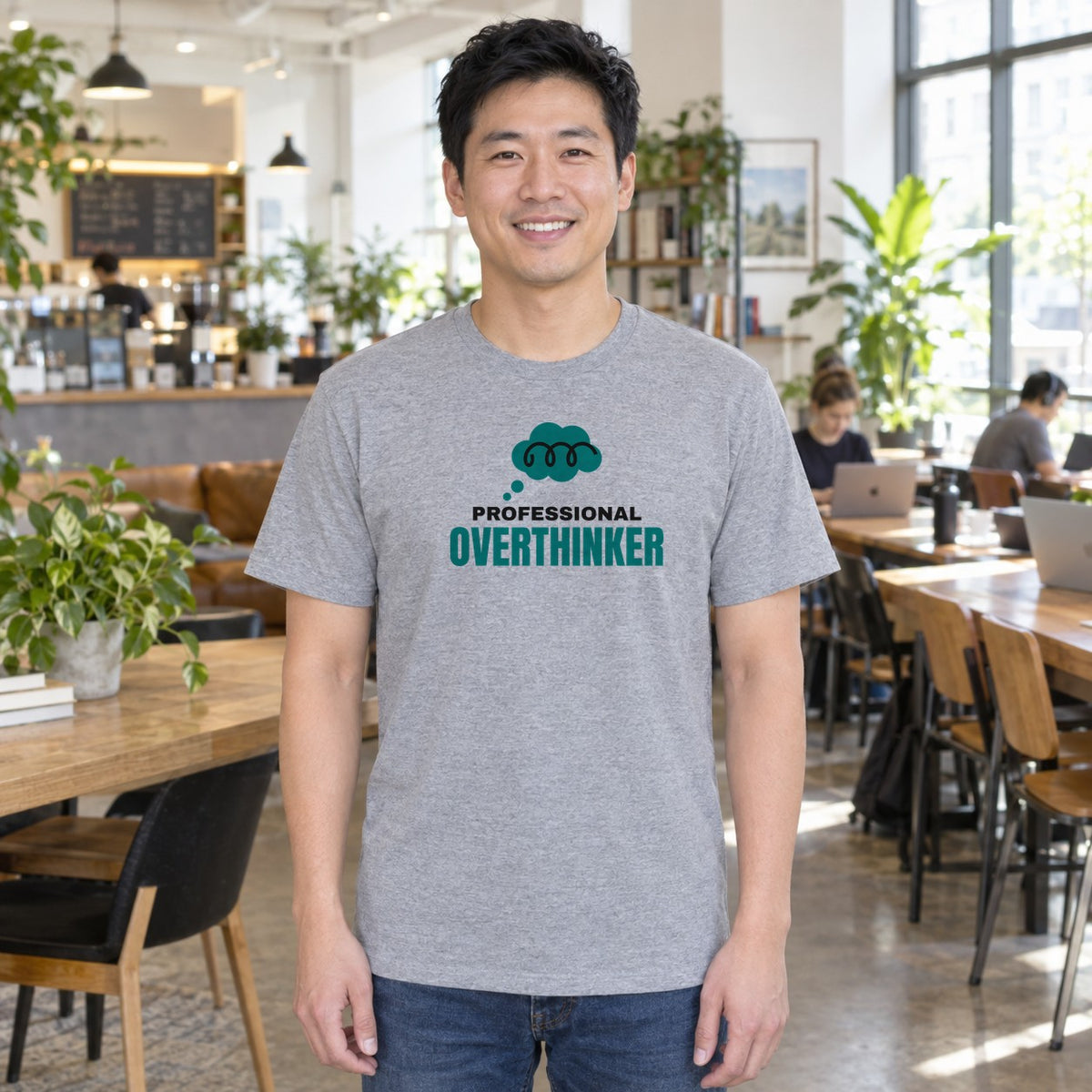 Man wearing the sport grey Professional Overthinker graphic tee