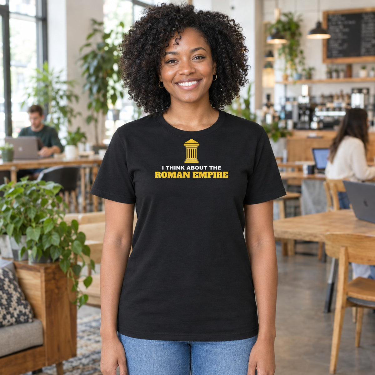 Woman wearing the black Roman Empire graphic tee