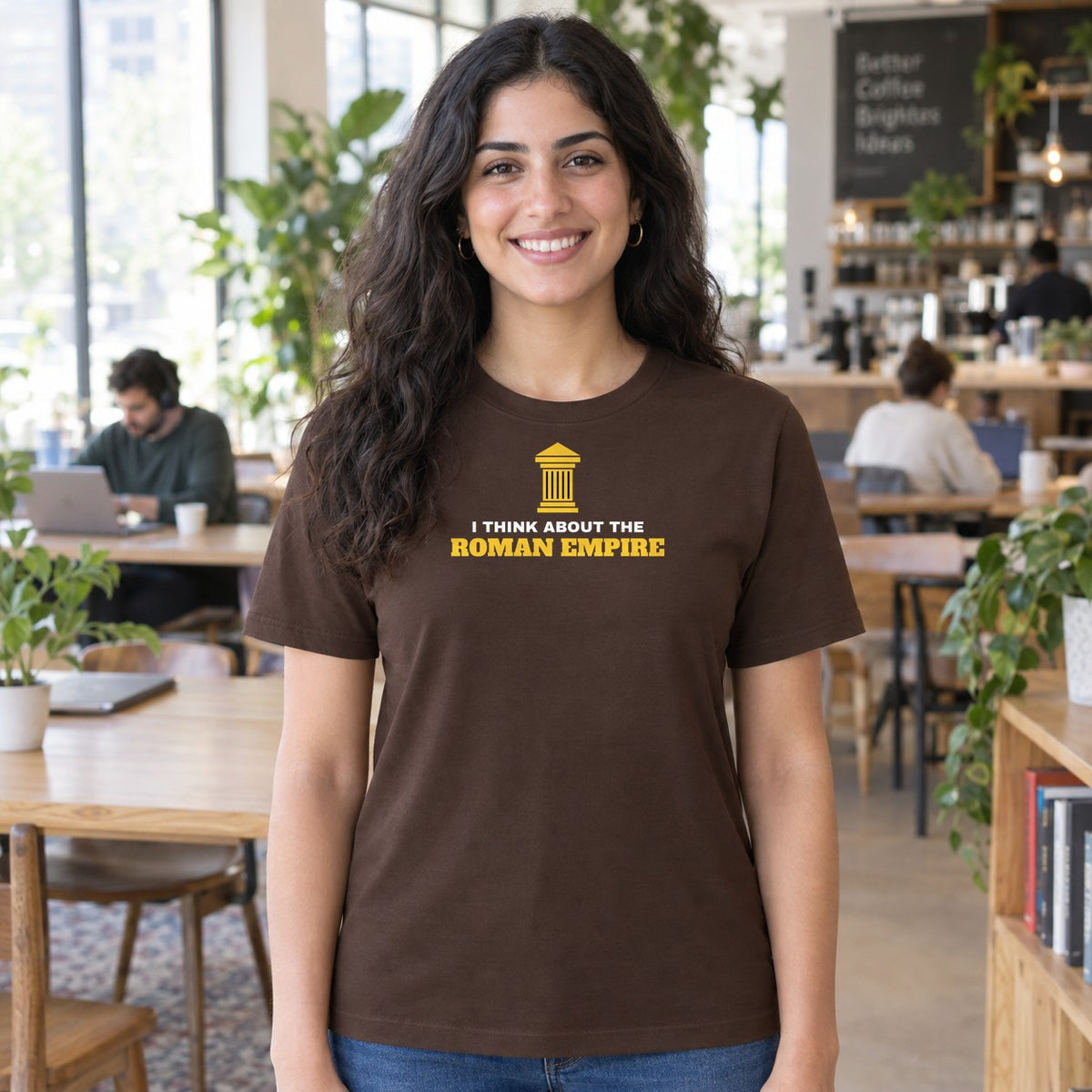 Woman wearing the dark chocolate Roman Empire graphic tee