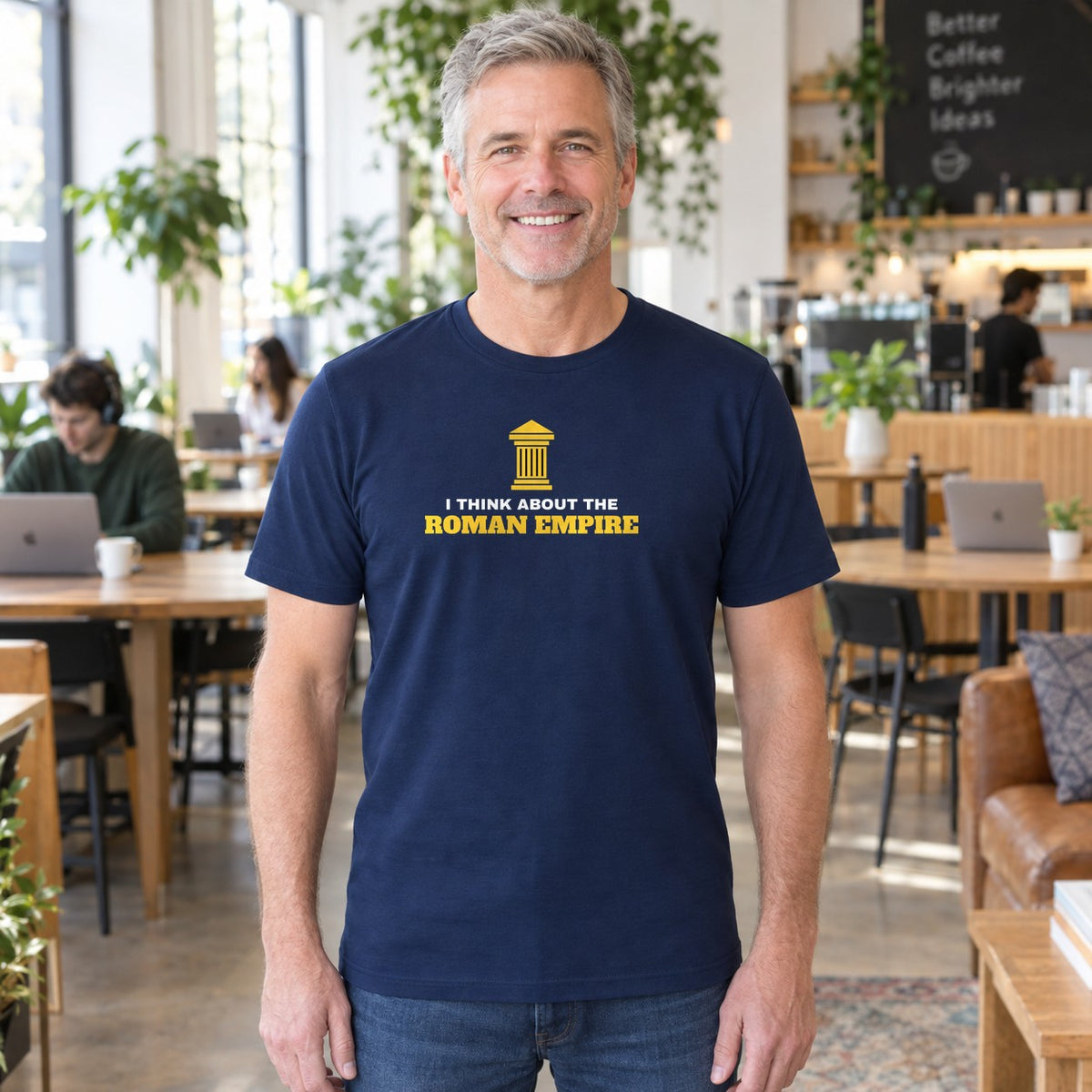 Man wearing the navy Roman Empire graphic tee