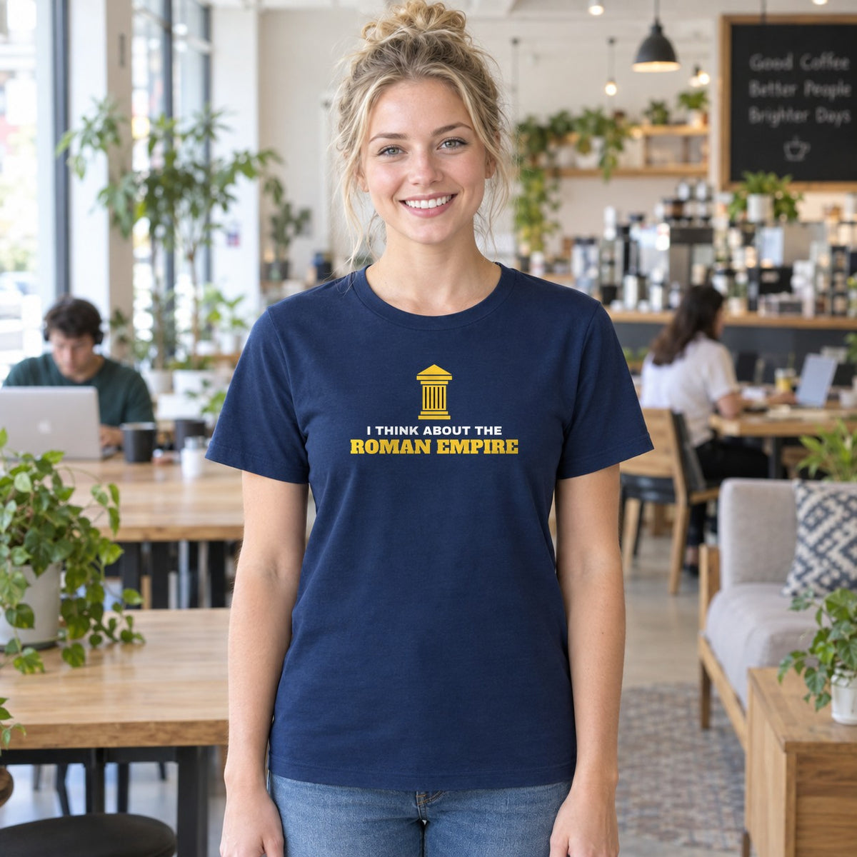 Woman wearing the navy Roman Empire graphic tee