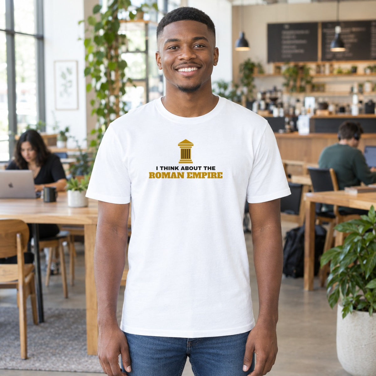 Man wearing the white Roman Empire graphic tee
