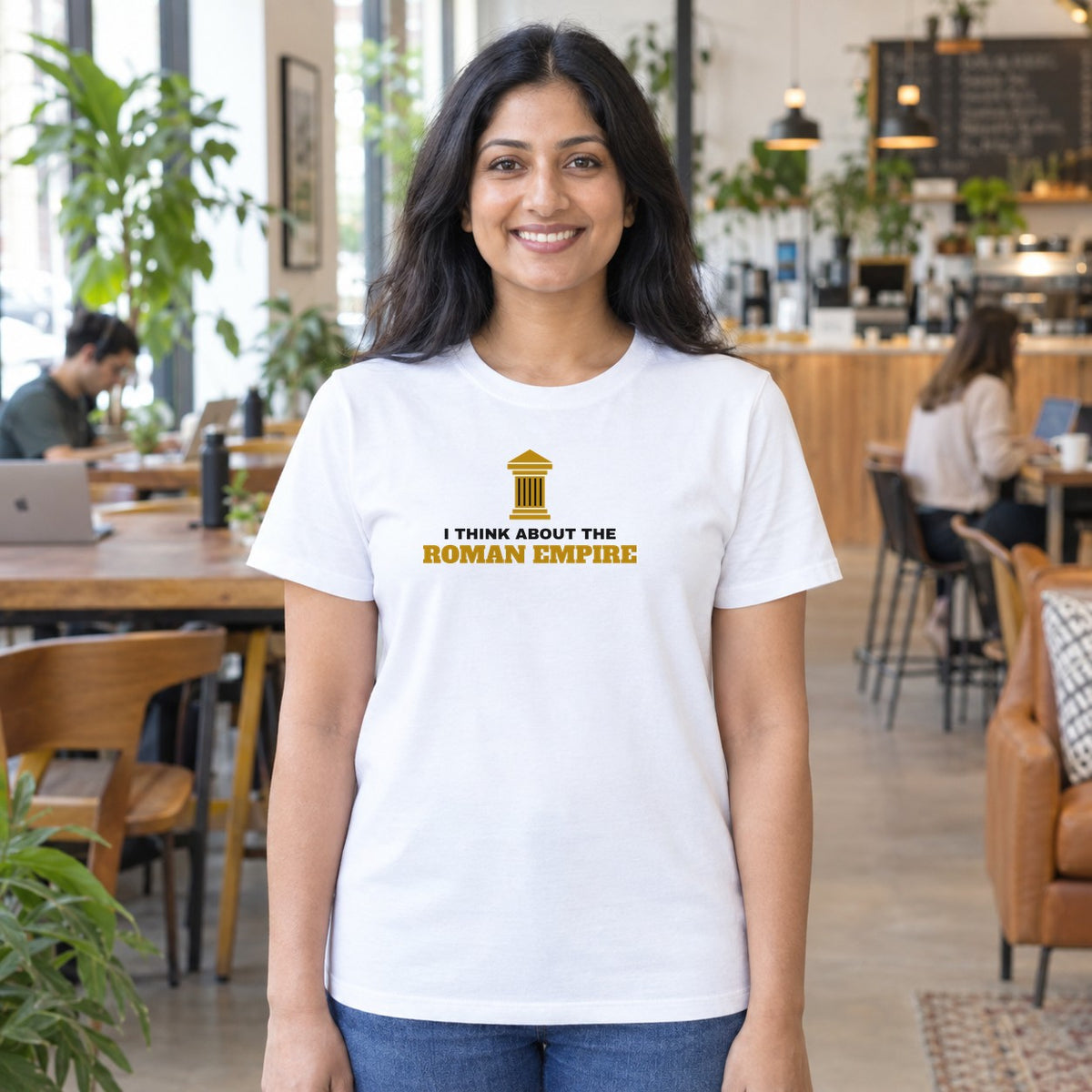 Woman wearing the white Roman Empire graphic tee