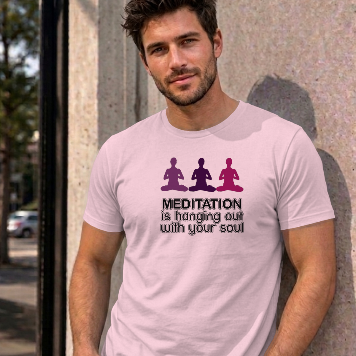 Man wearing the light pink Meditation graphic tee