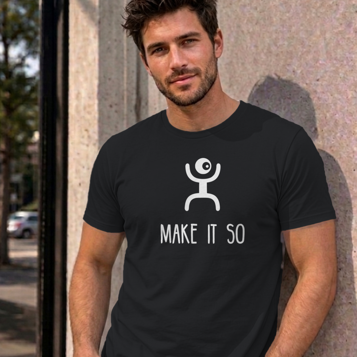 Man wearing the black Make It So graphic tee