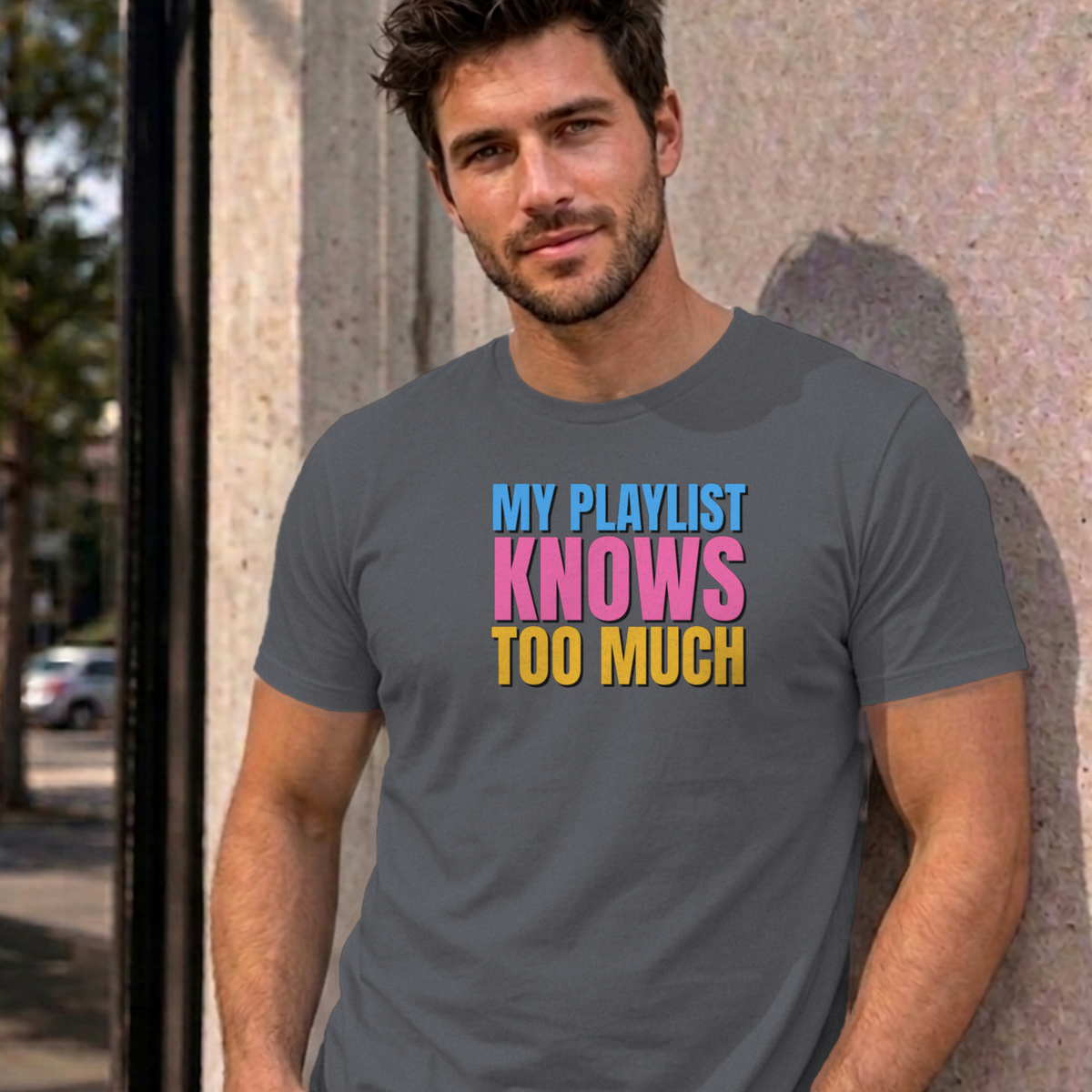 Man wearing the charcoal My Playlist Knows Too Much graphic tee