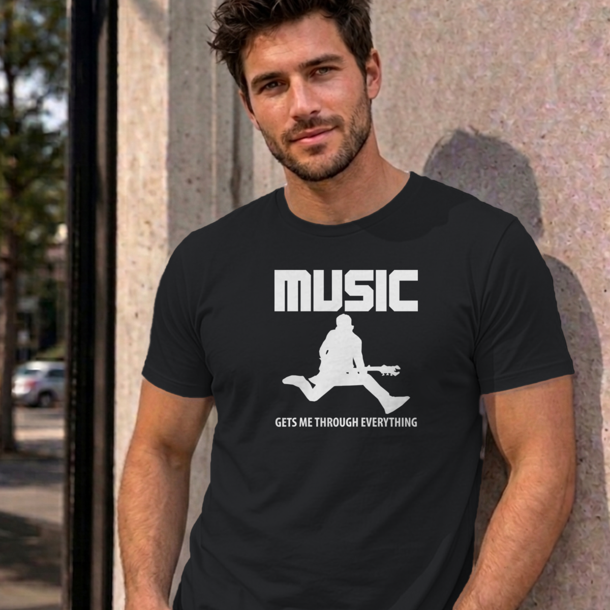 Man wearing the black Music Gets Me Through graphic tee