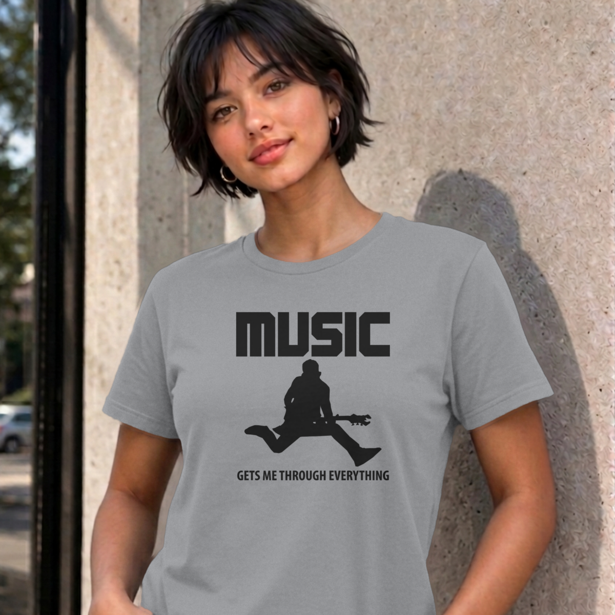 Woman wearing the sport grey Music Gets Me Through graphic tee