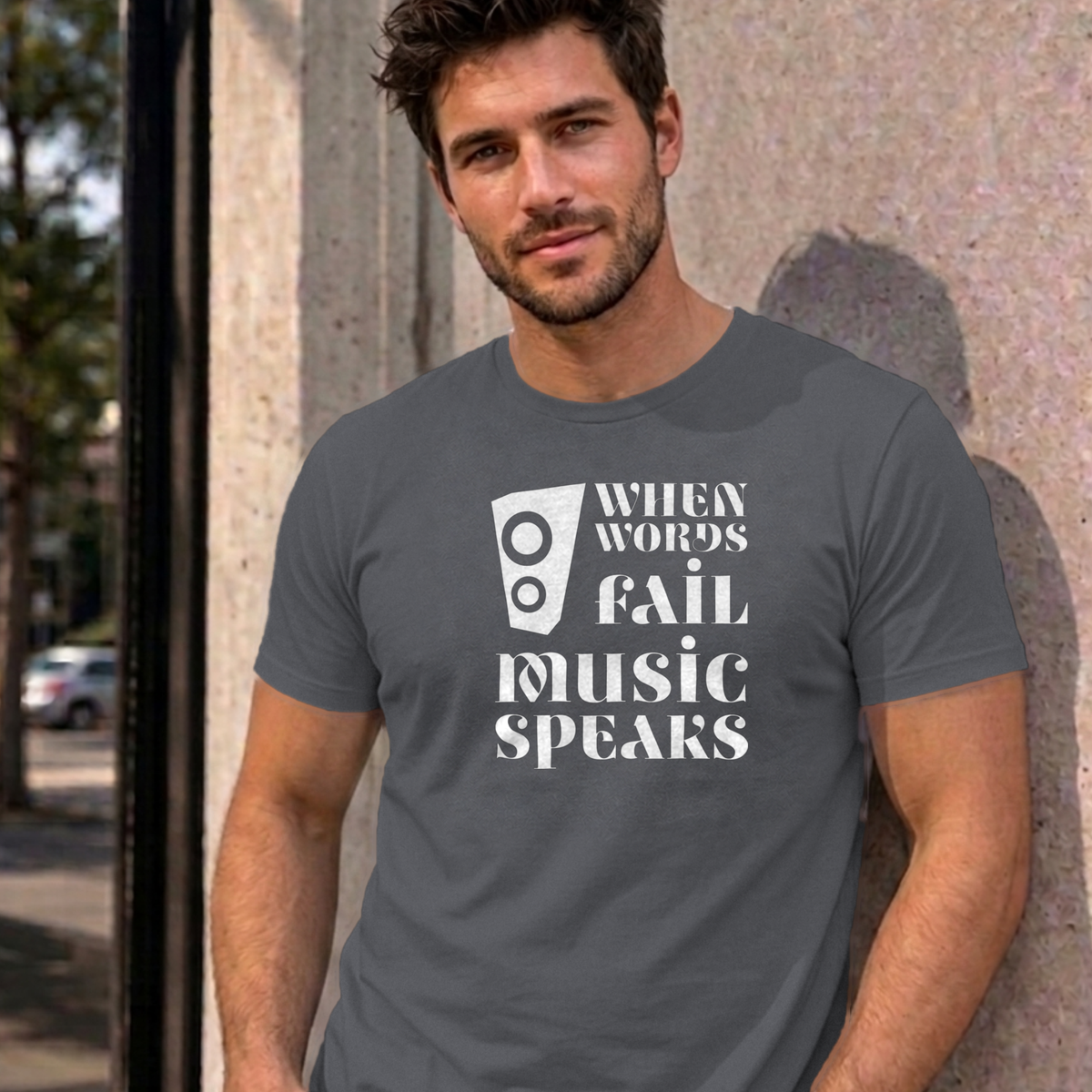 Man wearing the charcoal Music Speaks graphic tee