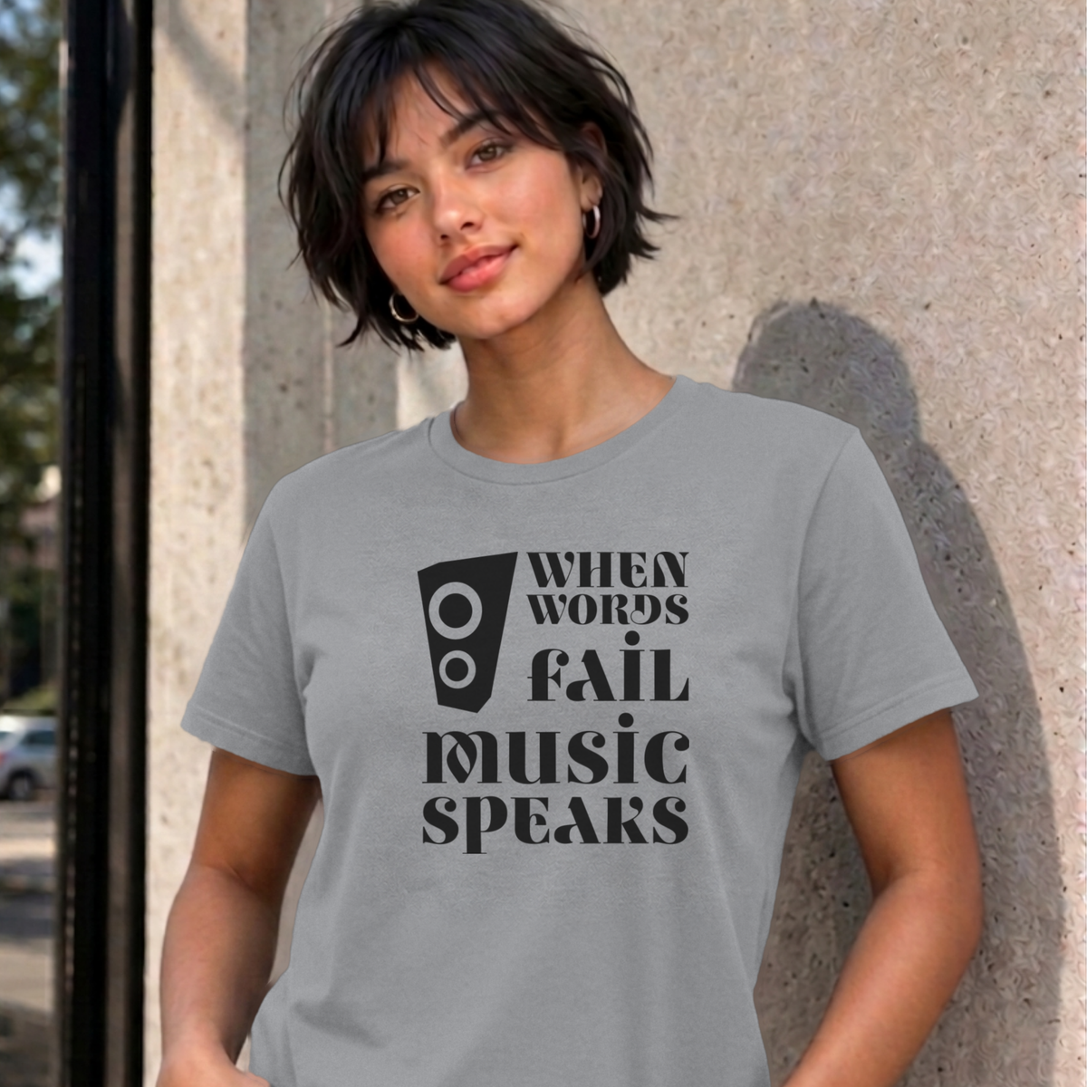 Woman wearing the sport grey Music Speaks graphic tee