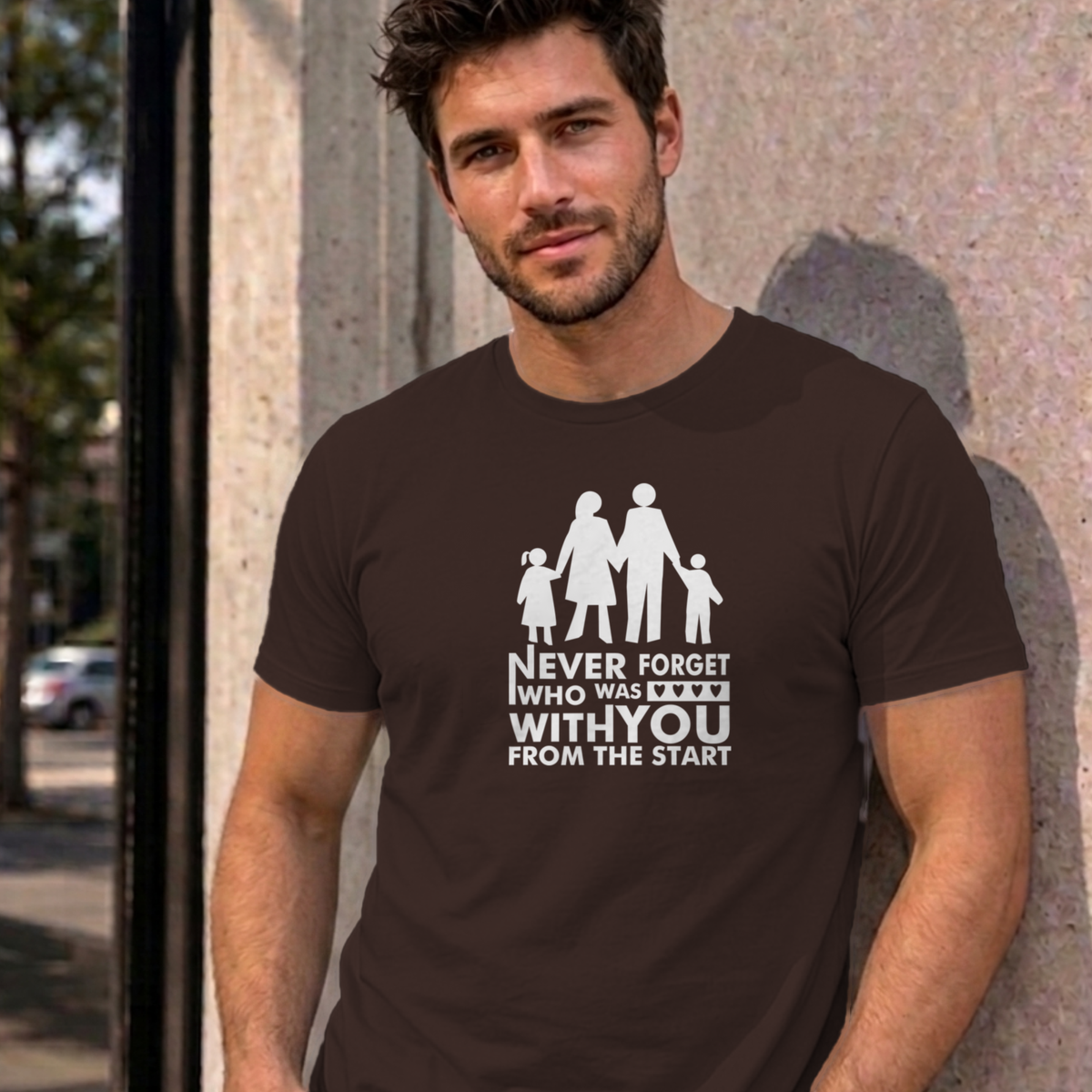 Man wearing the dark chocolate Never Forget Family graphic tee