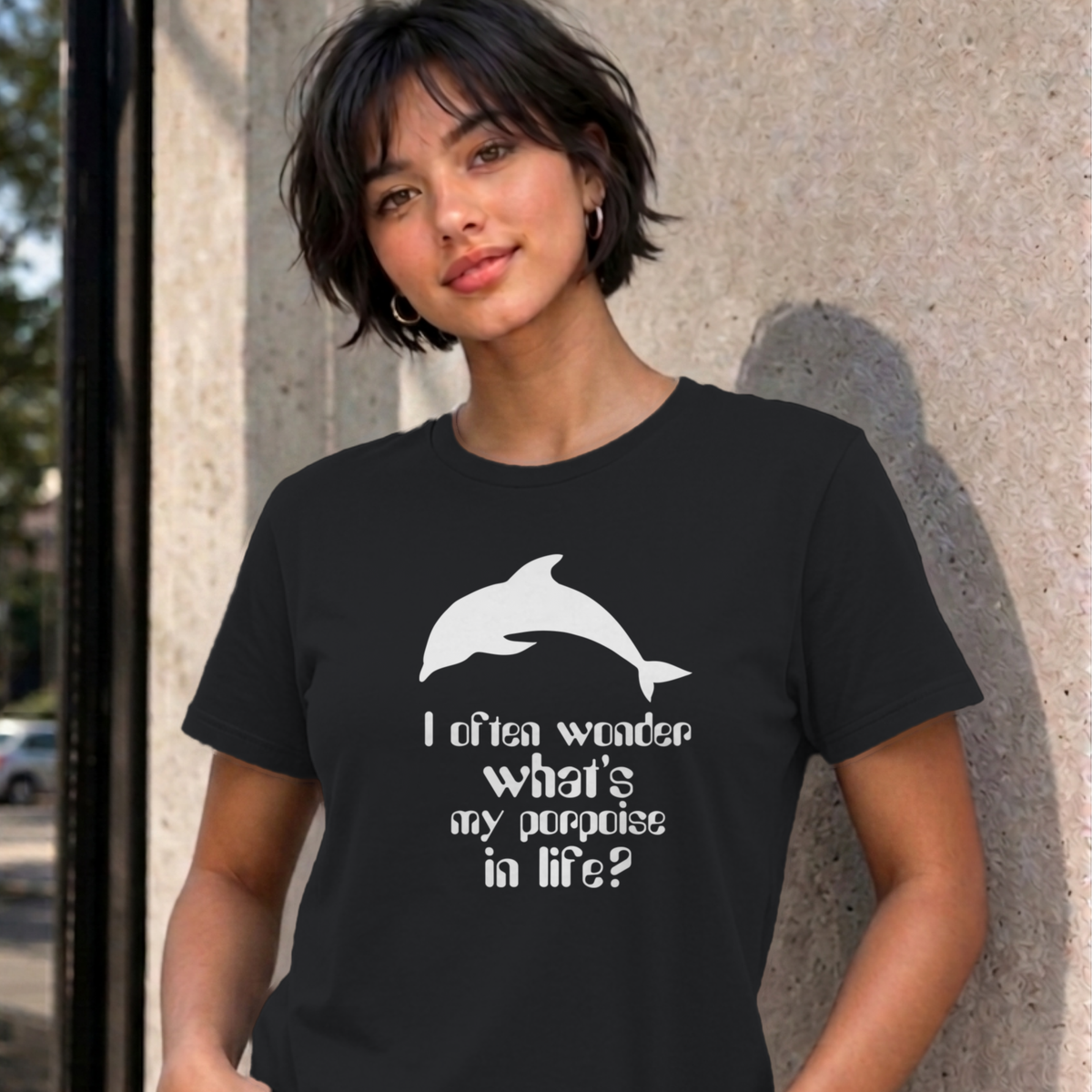 Woman wearing the black I Often Wonder graphic tee