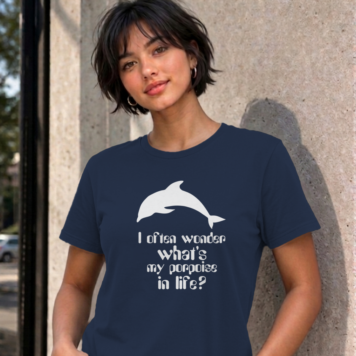 Woman wearing the navy I Often Wonder graphic tee