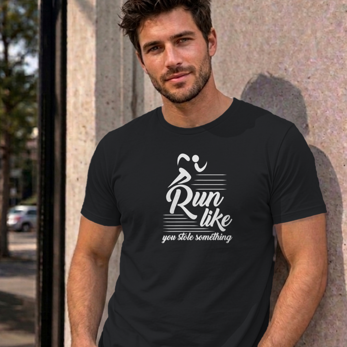 Man wearing the black Run Like You Stole Something graphic tee