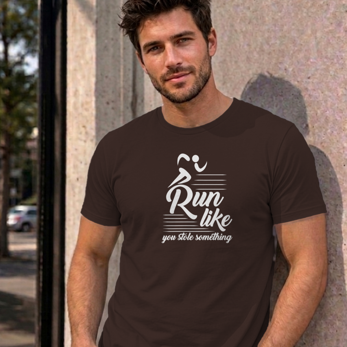 Man wearing the dark chocolate Run Like You Stole Something graphic tee