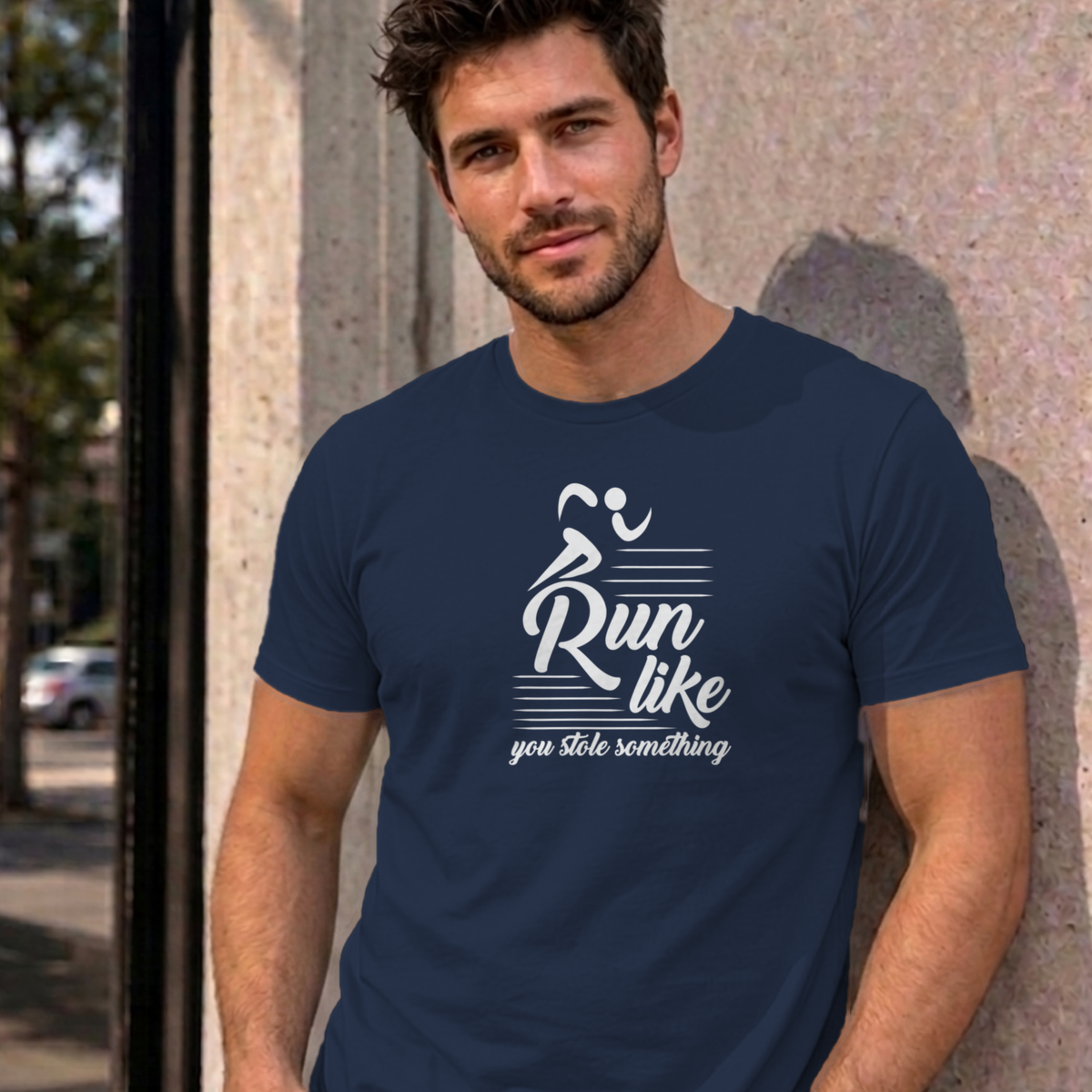 Man wearing the navy Run Like You Stole Something graphic tee