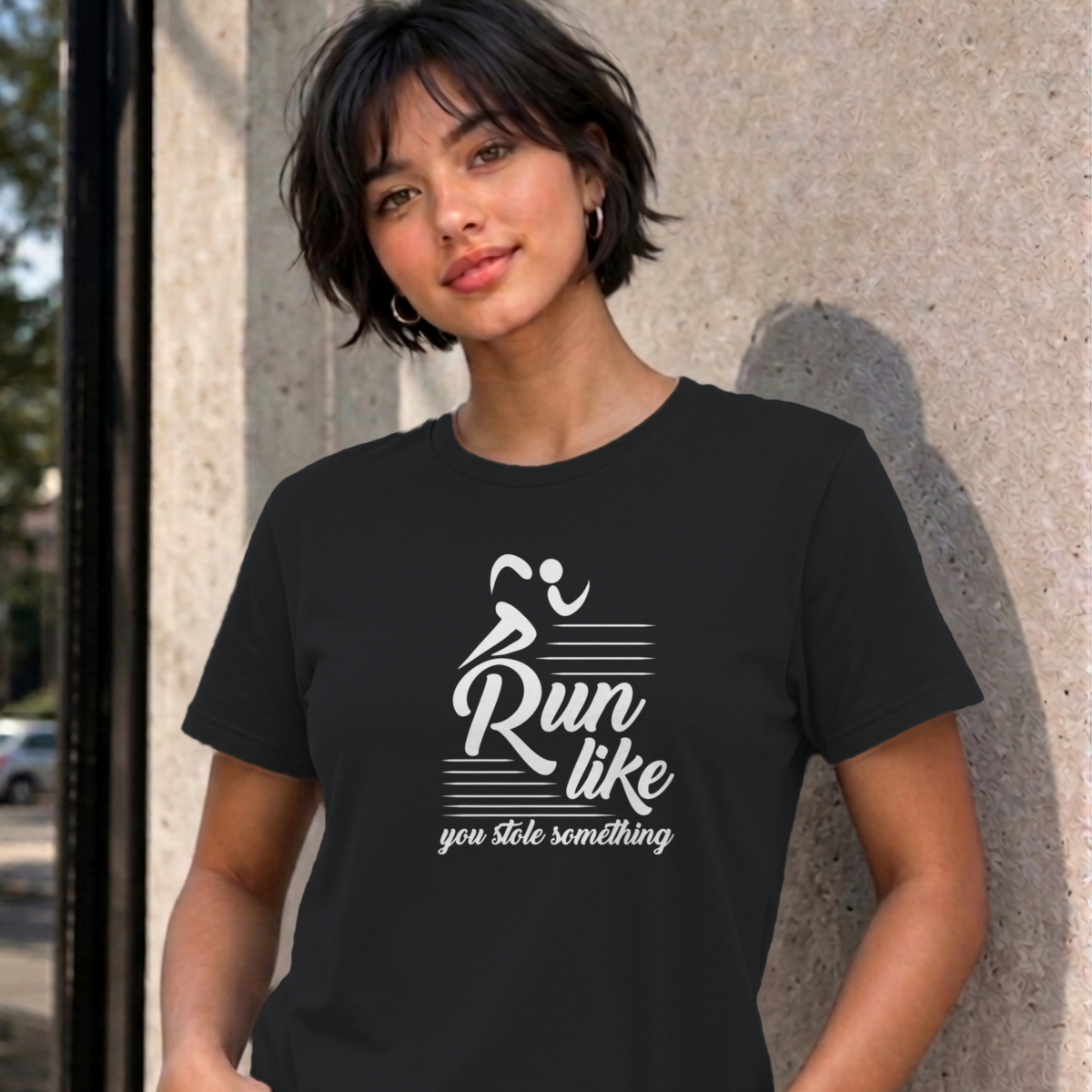 Woman wearing the black Run Like You Stole Something graphic tee