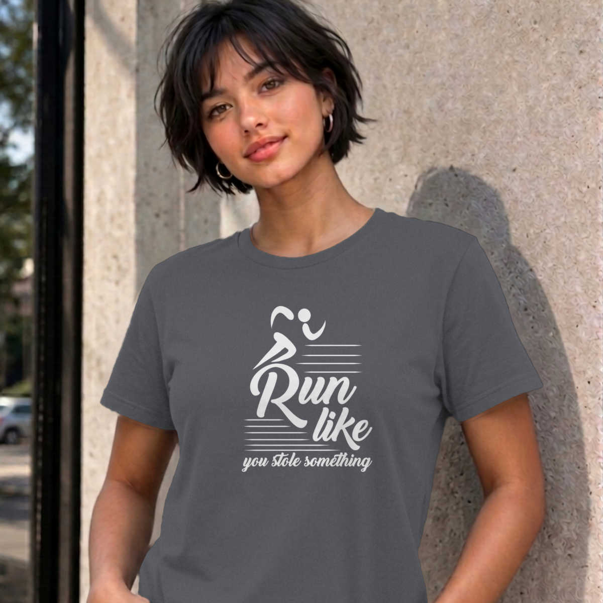 Woman wearing the charcoal Run Like You Stole Something graphic tee