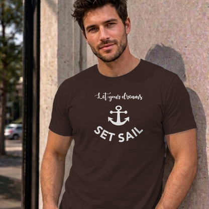 Man wearing the dark chocolate Let Your Dreams Set Sail graphic tee