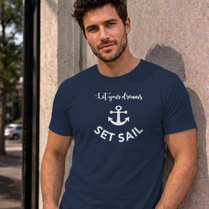 Man wearing the navy Let Your Dreams Set Sail graphic tee