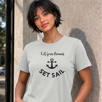 Woman wearing the ash Let Your Dreams Set Sail graphic tee
