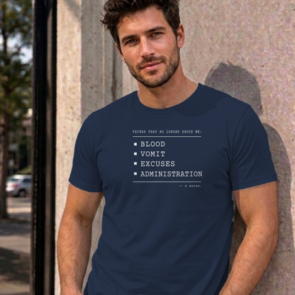 Man wearing the navy Nurse No Longer Shocked graphic tee