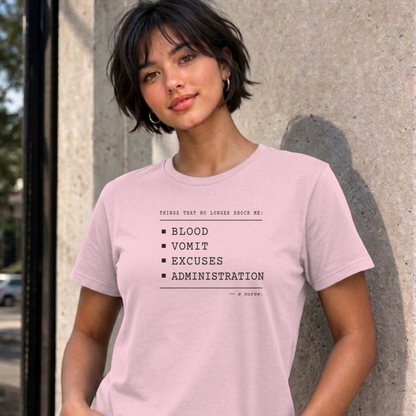 Woman wearing the light pink Nurse No Longer Shocked graphic tee