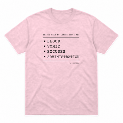 Nurse No Longer Shocked graphic tee in light pink with black print, front view