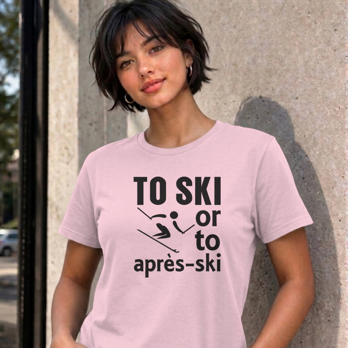 Woman wearing the light pink Ski graphic tee