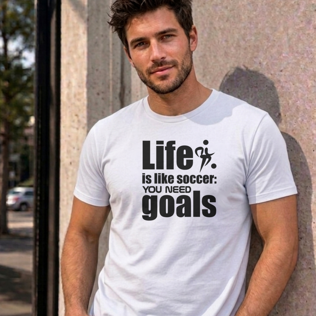 Man wearing the white Life Is Like Soccer graphic tee