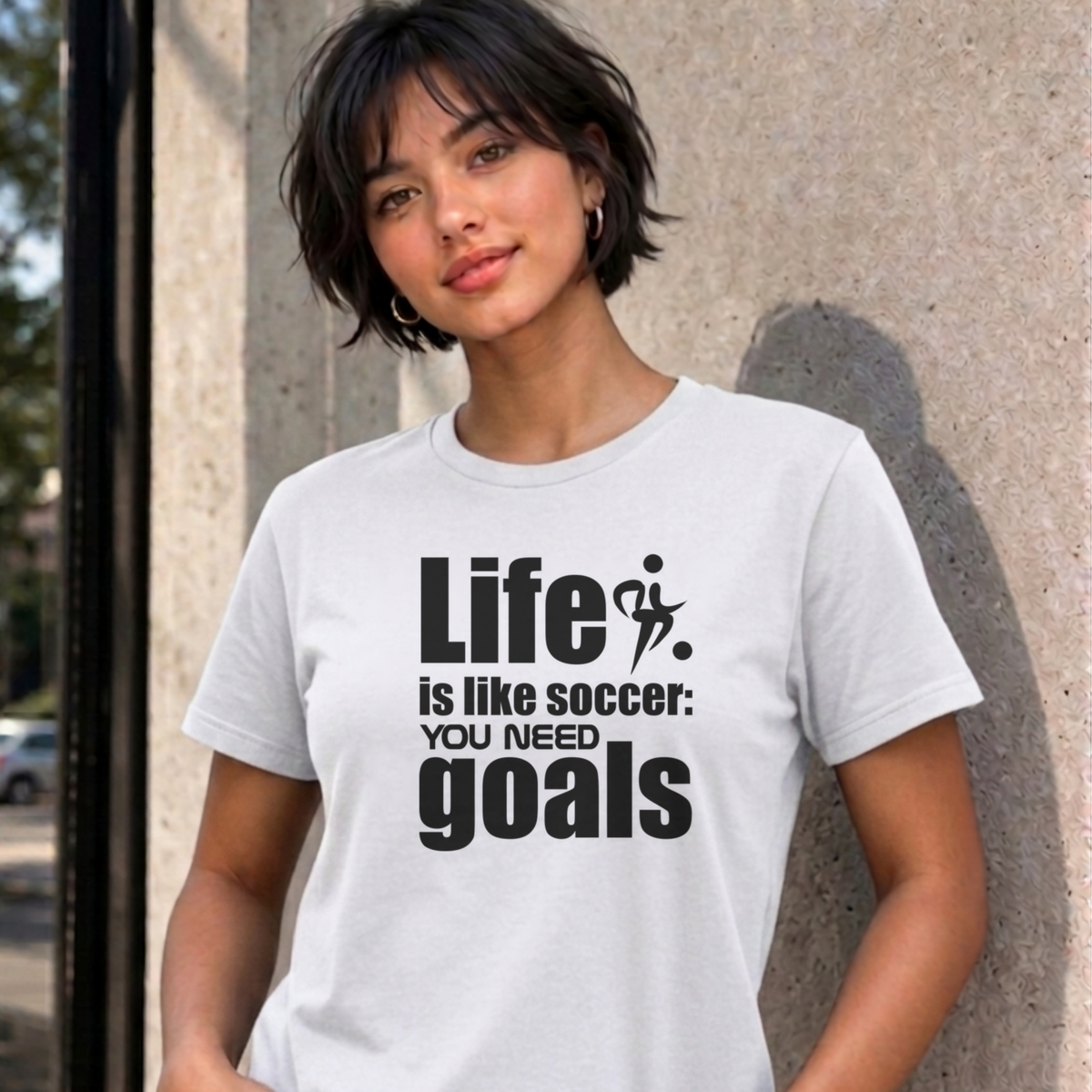 Woman wearing the white Life Is Like Soccer graphic tee