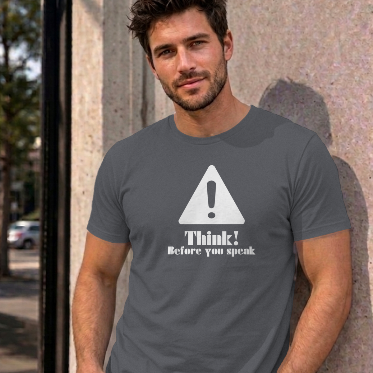Man wearing the charcoal Think Before You Speak graphic tee